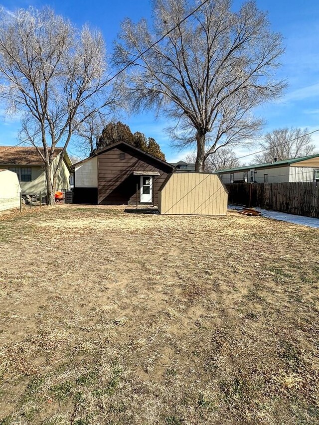 view of home's exterior with fence