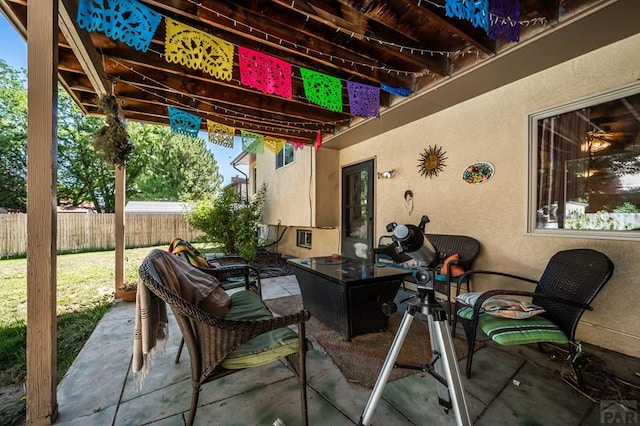 view of patio featuring fence