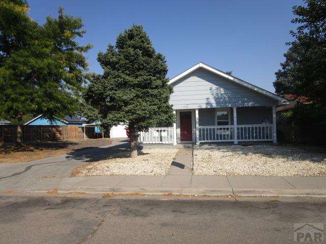 bungalow-style home with a porch and a fenced front yard