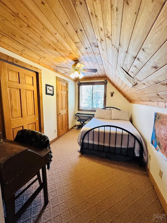 bedroom featuring lofted ceiling, wood ceiling, baseboards, and light carpet