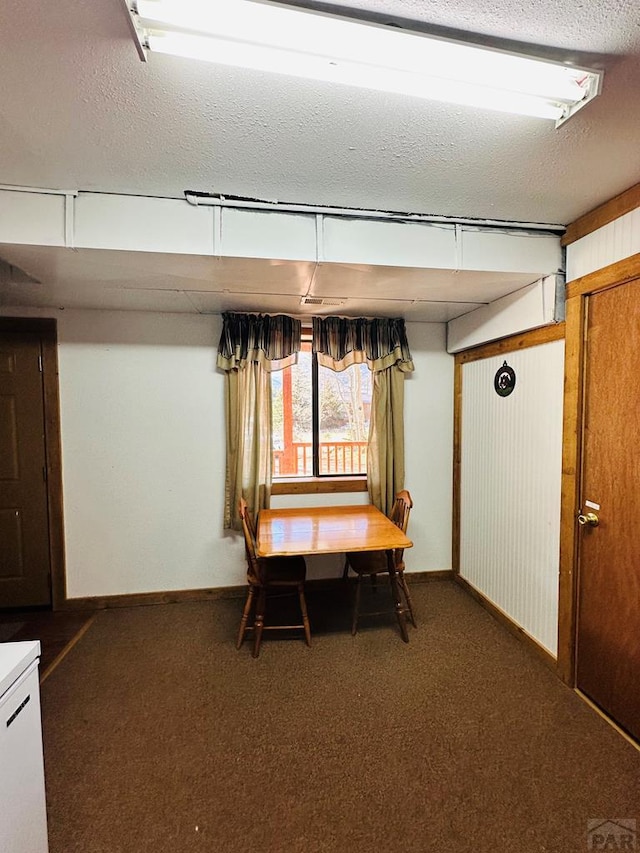 834 Ponderosa Rd, Cuchara, CO 81055 - carpeted dining space with a textured ceiling and baseboards