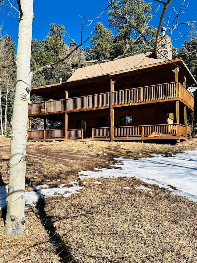 834 Ponderosa Rd, Cuchara, CO 81055 - view of home's exterior featuring roof with shingles and a wooden deck