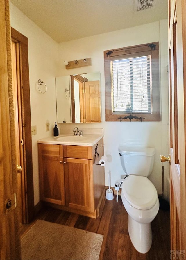 834 Ponderosa Rd, Cuchara, CO 81055 - bathroom featuring vanity, wood finished floors, and toilet