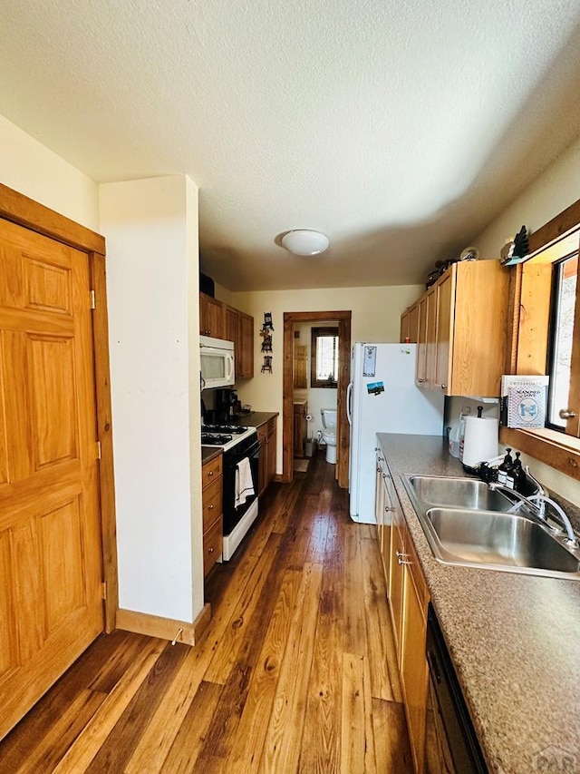 834 Ponderosa Rd, Cuchara, CO 81055 - kitchen with white microwave, gas stove, a sink, hardwood / wood-style flooring, and a textured ceiling