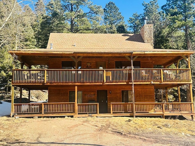 834 Ponderosa Rd, Cuchara, CO 81055 - view of front facade featuring a chimney and roof with shingles