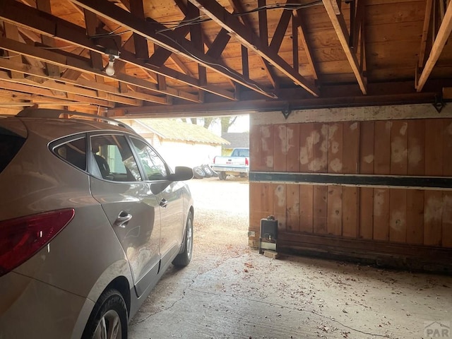 garage featuring wood walls