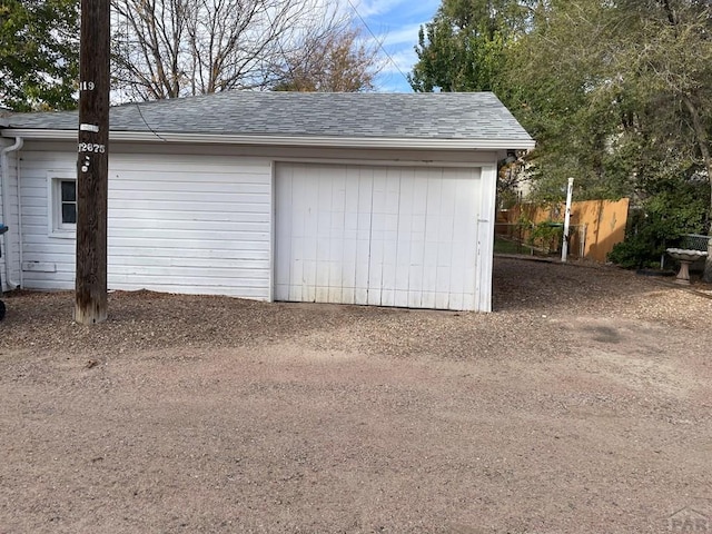 garage with fence