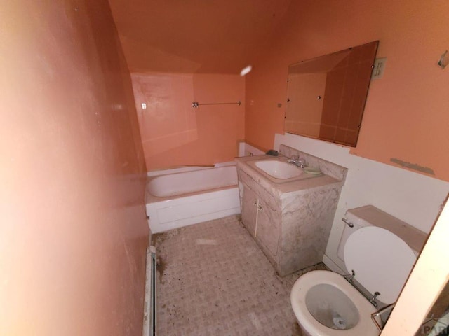 full bath featuring vanity and toilet