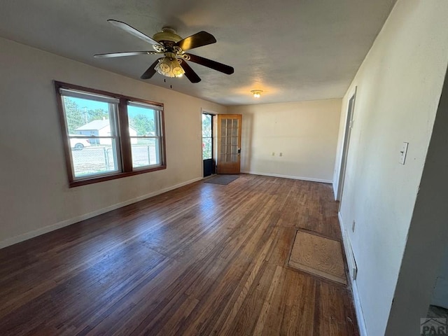 303 8th St, Fowler, CO 81039 - spare room featuring wood finished floors, a ceiling fan, and baseboards
