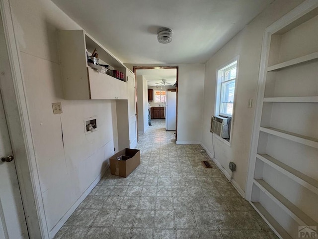 303 8th St, Fowler, CO 81039 - hall featuring built in features, cooling unit, and baseboards