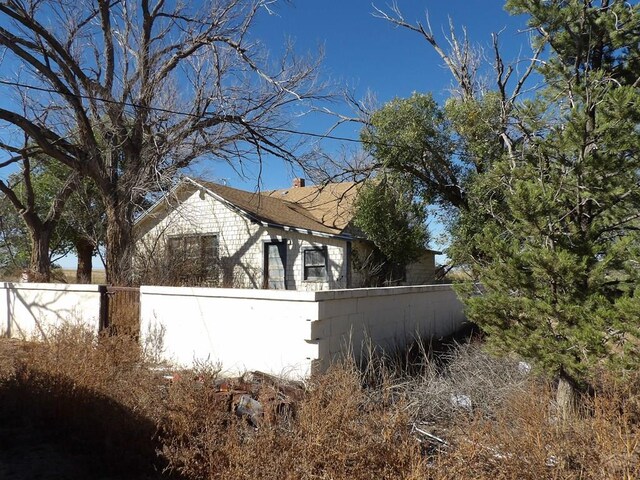 view of side of property with fence