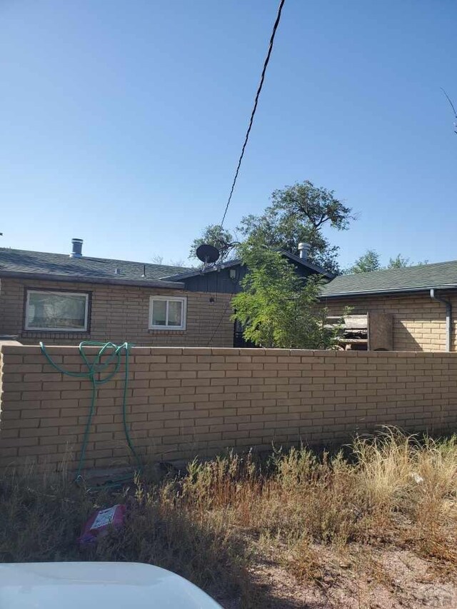 view of side of home featuring brick siding