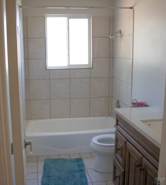 full bathroom with toilet, tile patterned flooring, shower / bathing tub combination, and vanity