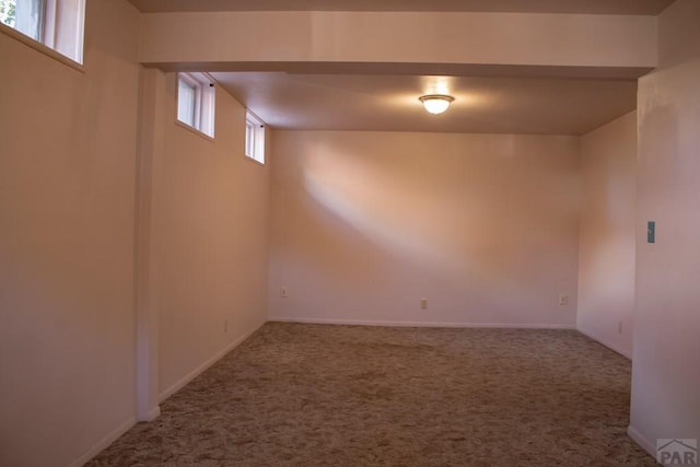 below grade area with carpet floors and baseboards