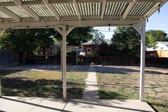 view of yard with fence private yard and a pergola