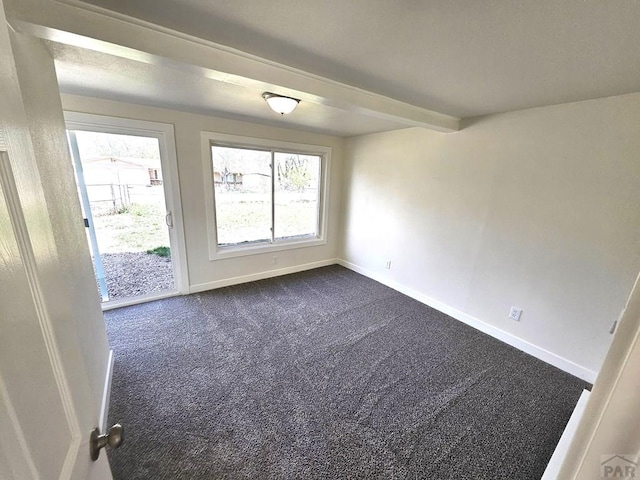 802 E 5th St, Florence, CO 81226 - spare room with baseboards and dark colored carpet
