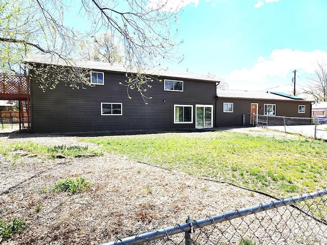 802 E 5th St, Florence, CO 81226 - back of house with a fenced backyard and a yard