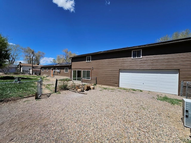 802 E 5th St, Florence, CO 81226 - exterior space featuring fence, driveway, and a garage