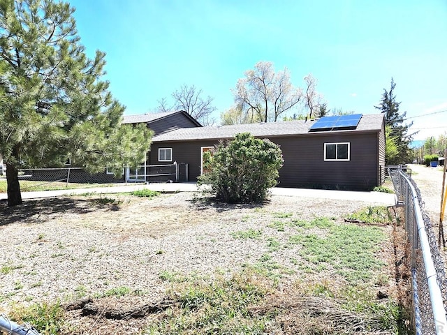 802 E 5th St, Florence, CO 81226 - back of property with fence and solar panels