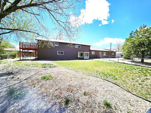 802 E 5th St, Florence, CO 81226 - rear view of property with a lawn and a fenced backyard