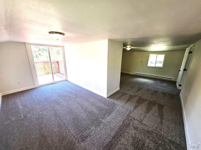 802 E 5th St, Florence, CO 81226 - unfurnished room with a textured ceiling, carpet flooring, baseboards, and a baseboard radiator