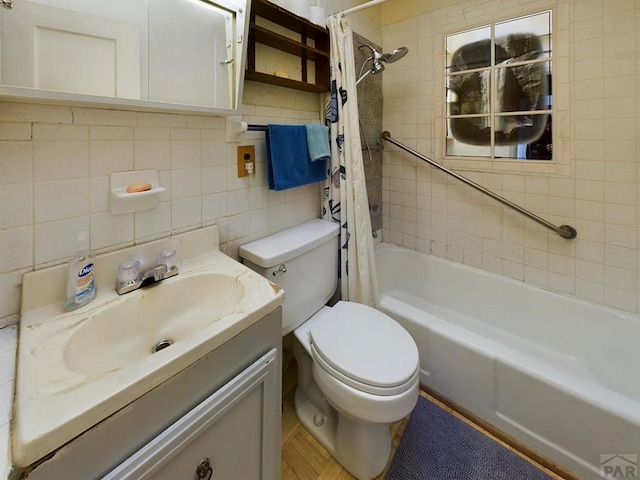 bathroom with toilet, tile walls, vanity, decorative backsplash, and shower / bath combo