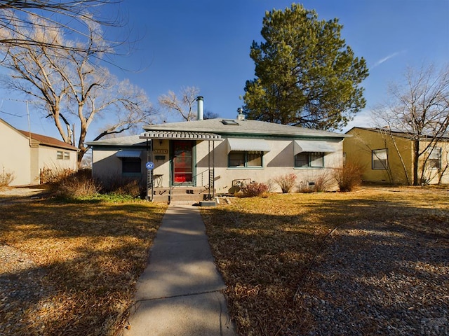 bungalow-style house with crawl space and stucco siding