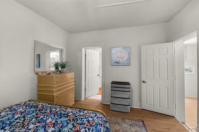 bedroom with wood finished floors