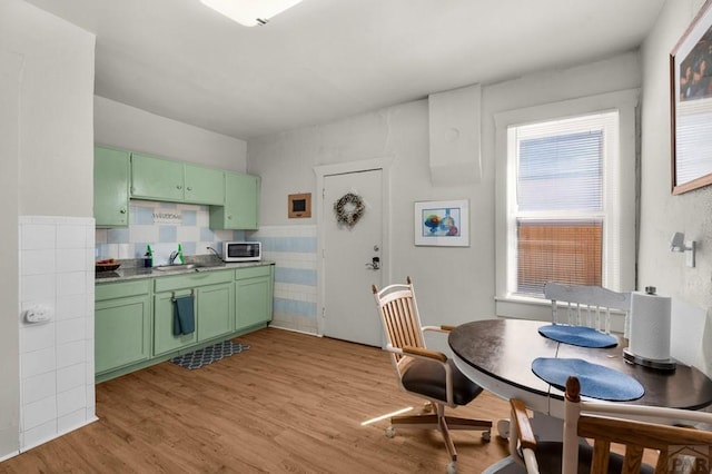 dining space with light wood finished floors