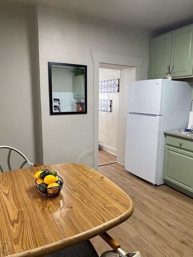 unfurnished dining area with light wood-style flooring