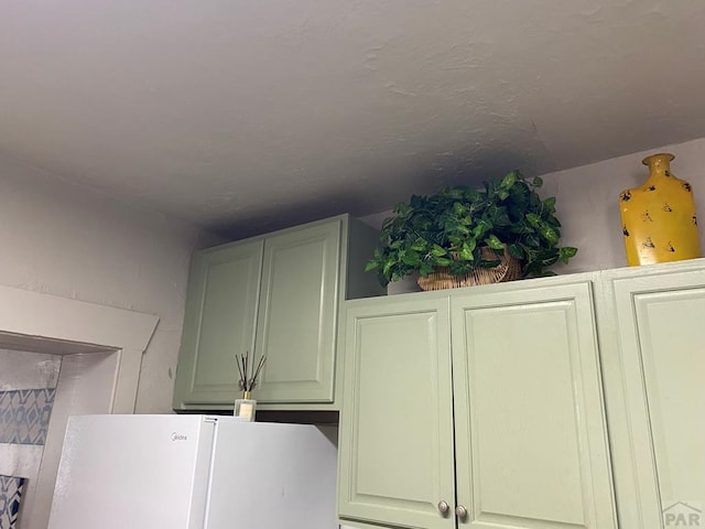 interior details featuring freestanding refrigerator