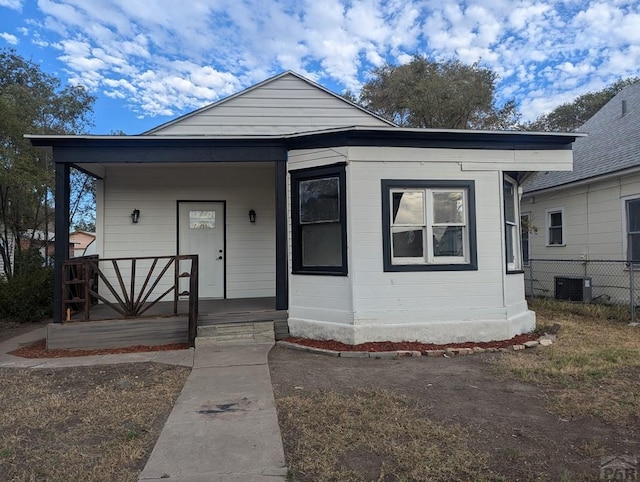 bungalow-style house with a porch and fence