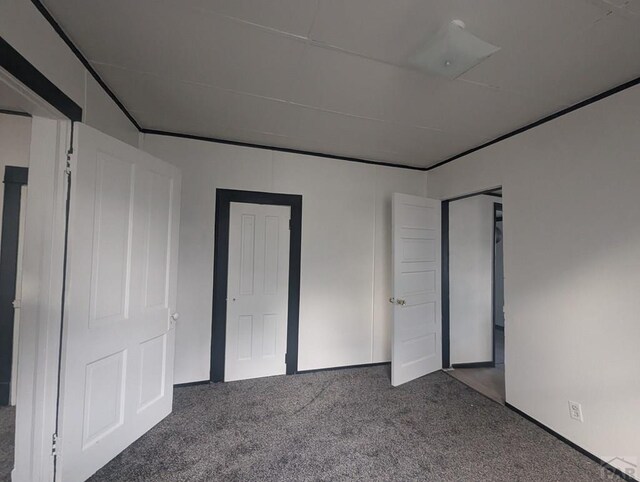 unfurnished bedroom with carpet