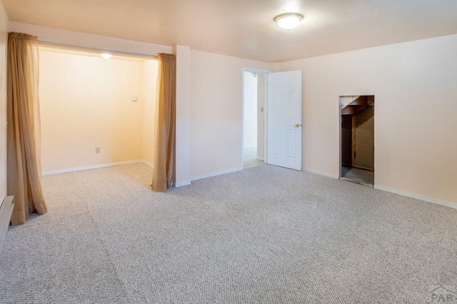 unfurnished bedroom featuring baseboards and carpet floors