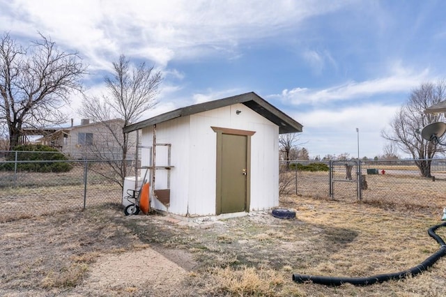 view of shed with a fenced backyard