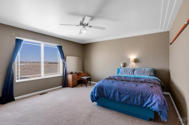 carpeted bedroom featuring baseboards, visible vents, and ceiling fan