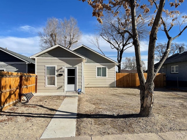 bungalow with a fenced backyard