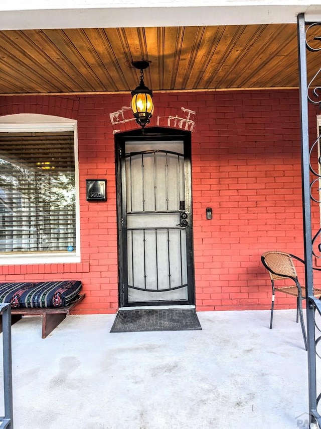 entrance to property with brick siding