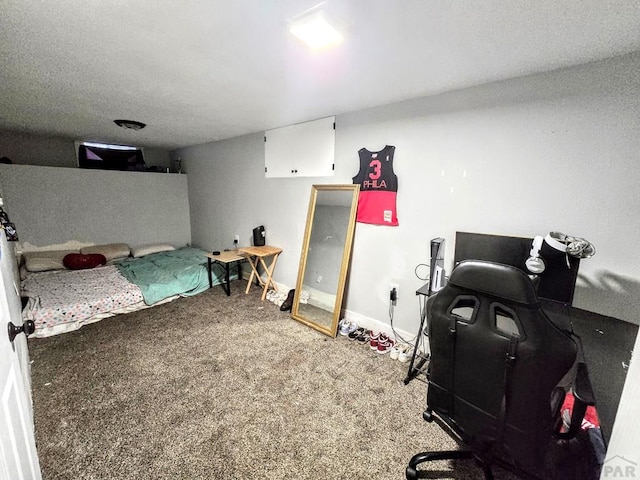 carpeted bedroom featuring baseboards