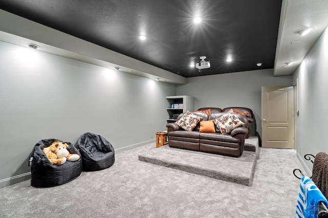 carpeted home theater featuring recessed lighting and baseboards