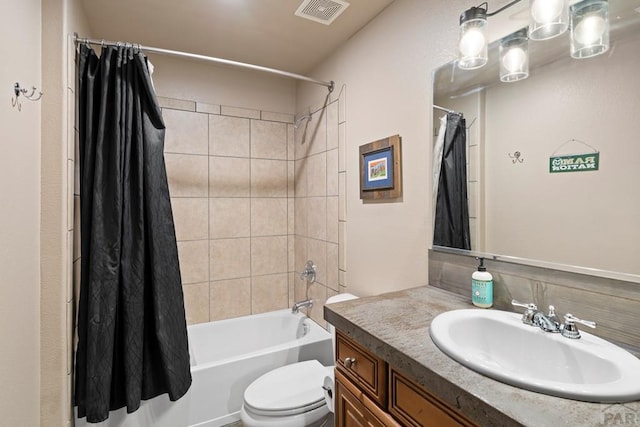 full bathroom featuring toilet, vanity, visible vents, and shower / bathtub combination with curtain