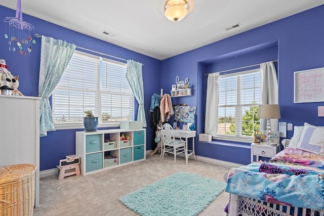 bedroom featuring carpet floors, visible vents, and baseboards