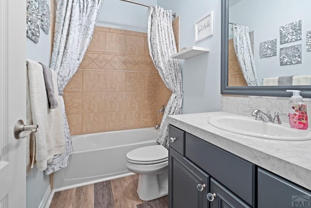 full bathroom with toilet, vanity, shower / bath combination with curtain, and wood finished floors