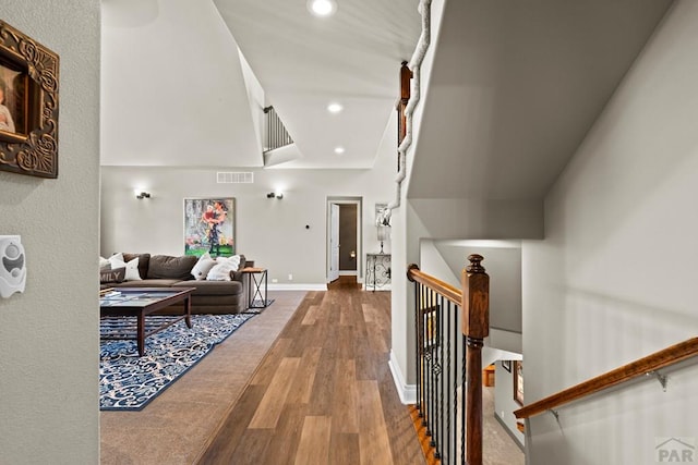 interior space featuring baseboards, wood finished floors, visible vents, and recessed lighting