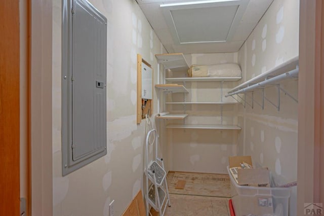 interior space featuring attic access and electric panel