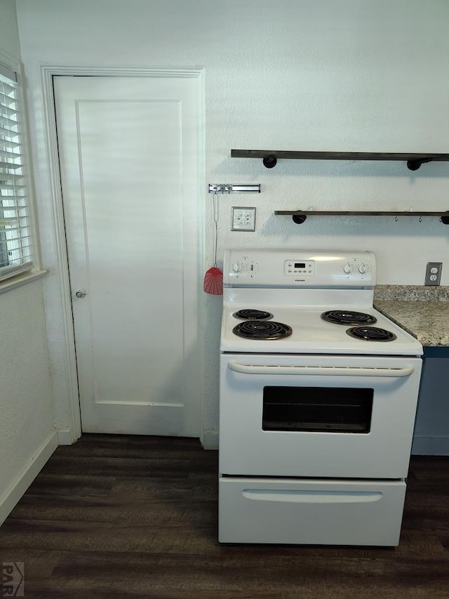 726 W Corona Ave, Pueblo, CO 81004 - kitchen featuring white electric range oven, dark wood-style floors, and light countertops