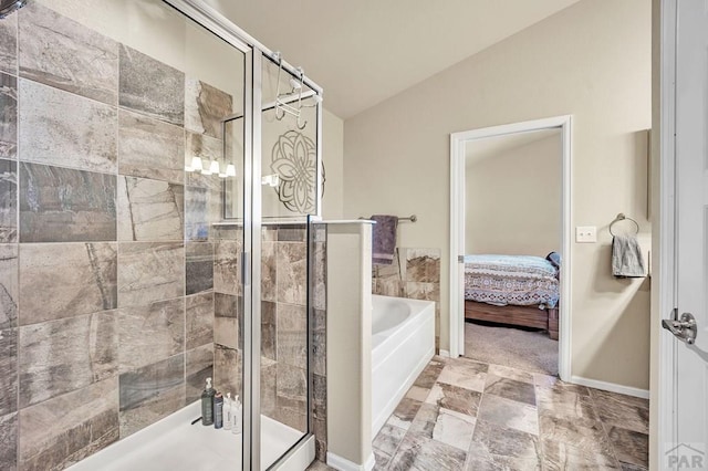 full bath with a garden tub, ensuite bath, vaulted ceiling, and a shower stall