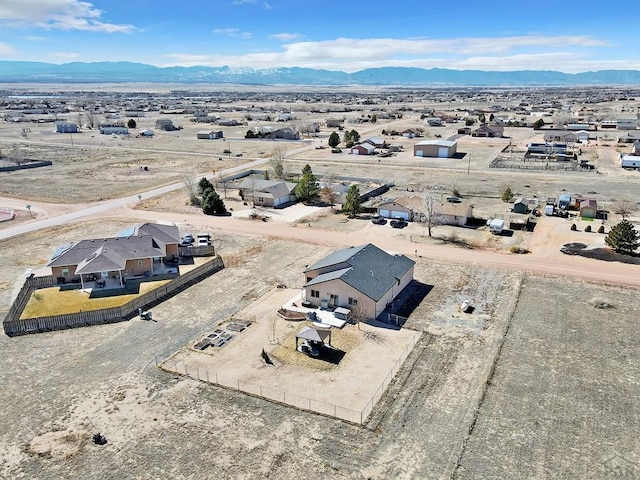 aerial view with a mountain view and view of desert