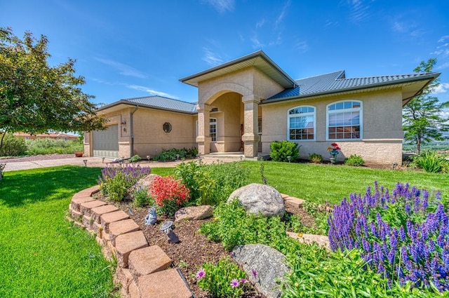 view of front of property featuring a garage, a front yard, concrete driveway, and stucco siding