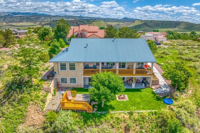 birds eye view of property with a mountain view